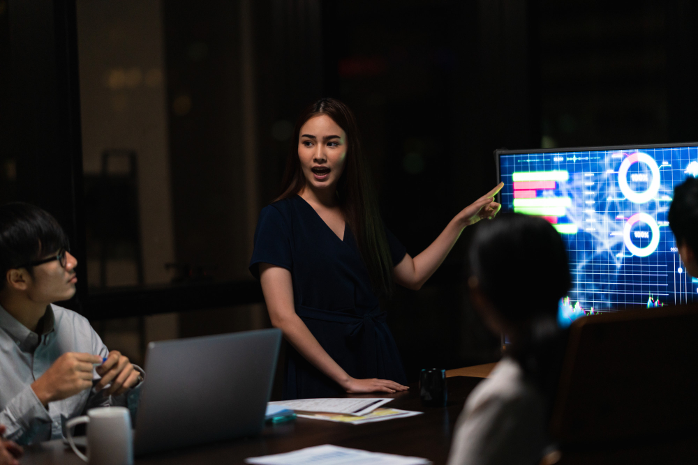 Businesswoman presenting trading charts to explain what is a prop firm